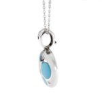 profilo ciondolo oro bianco con turchesi e diamanti su collana oro bianco