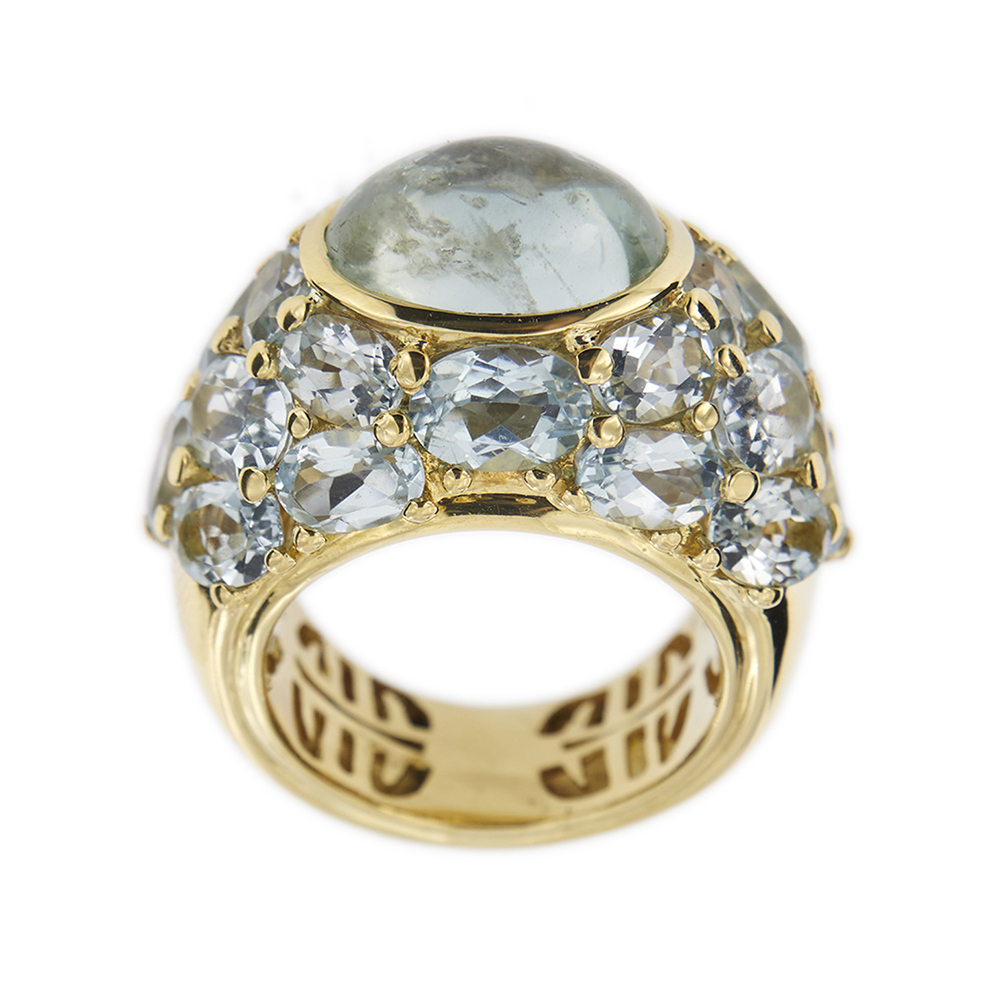 Band ring with aquamarine and topazes