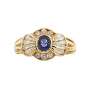 anello vintage a fiocco in oro giallo con diamanti e zaffiro centrale