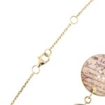 dettaglio moschettone di chiusura su collana in oro giallo con bottoni e perle 2