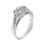anello esagonale in oro bianco con diamanti e acquamarina centrale