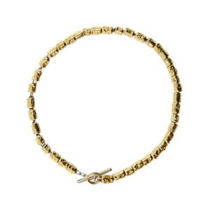 Bracciale in oro giallo e oro bianco 18kt, maglia rolò con granelli Dodo di Pomellato, ideale per aggiungere charms e chiusura a T.