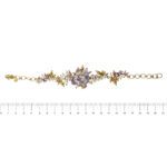 bracciale oro giallo con fiori smaltati, diamanti e pietre preziose Gabriella Rivalta foto paragone righello per misura lunghezza cm