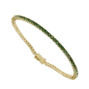 Bracciale tennis in oro giallo 14kt con 78 smeraldi da 0.05 ct cad., totale 3.9 ct chiusura a cassetto e due sicure.