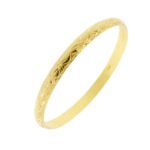 bracciale bangle in oro giallo con lavorazione