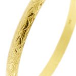 zoom dettaglio bracciale in oro giallo con lavorazioni