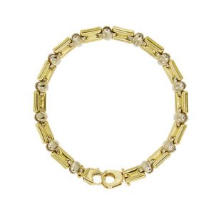Bracciale unisex, maglia a segmenti alternata da ovali in oro giallo e oro bianco 18kt con chiusura a moschettone.