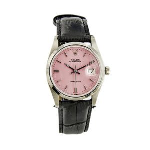 Orologio Rolex in acciaio Oysterdate Precision a carica manuale, referenza 6694, cassa 35 mm, quadrante rosa con indici, vetro plastica, cinturino nero; anno produzione: 1970-79. Brand: Rolex.