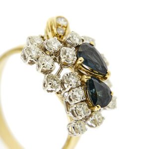 zoom dettaglio diamanti e zaffiri su anello oro giallo