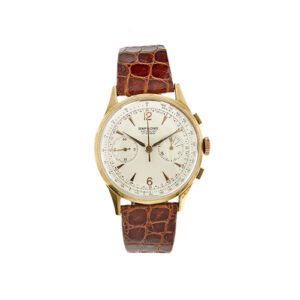 Orologio Simphonie incabloc 17 rubis in oro rosa 18kt, cronografo vintage movimento manuale, quadrante colore champagne con indici e numeri arabi (12 e 6), radiante alle 3 e alle 9, vetro plastica, cinturino in pelle di coccodrillo marrone.