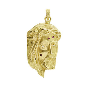 Ciondolo con viso di Cristo in rilievo in oro giallo 18kt, impreziositi con 3 rubini e 2 diamanti taglio huit huit da 0.03 ct cad. totale 0.06 ct - colore FG e purezza VS.