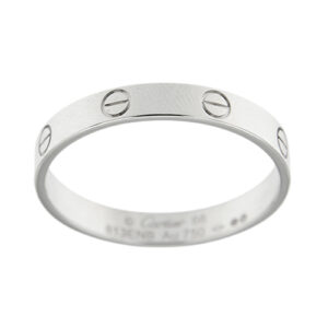 Anello fede in oro bianco 18kt con design lineare e viti grafiche, collezione LOVE. Brand: Cartier.