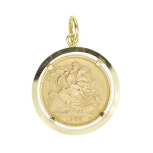 Ciondolo in oro giallo 18kt contenente una sterlina inglese del 1958 con la regina Elisabetta II in oro giallo 21kt.
