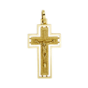 Ciondolo a croce in oro giallo 18kt con Gesù, retro con lavorazione floreale intagliata e designa cornice.