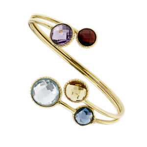 Bracciale rigido contrarié aperto a due fili con finali rotondi in oro giallo 18kt e 5 pietre: quarzo citrino, granato, ametista e 2 topazi.