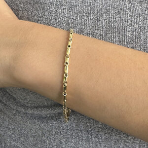 Foto gioiello indossata: bracciale in oro giallo Chimento segmenti bamboo